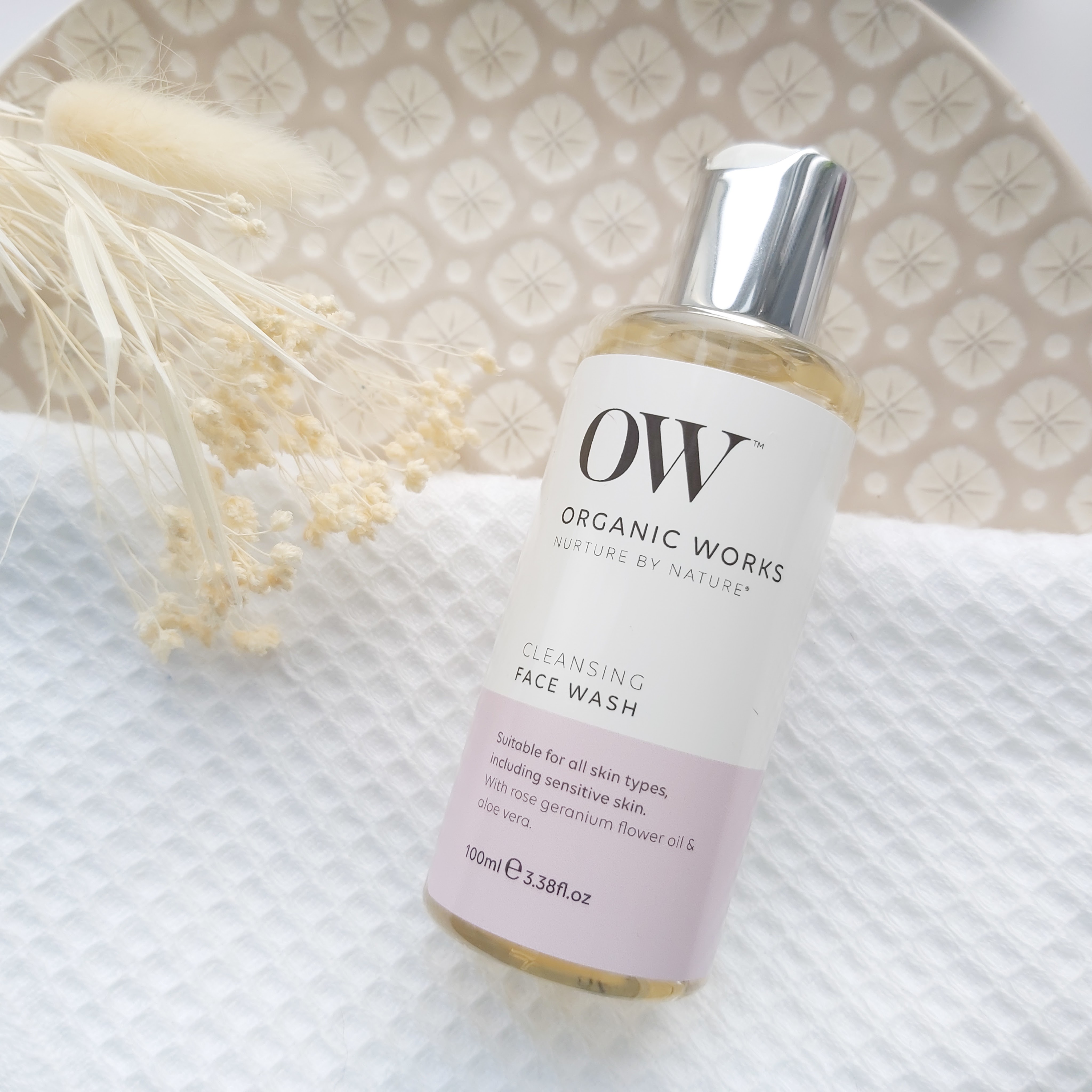Organic Works Cleansing Face Wash featured in The Natural Beauty Box May 2021 on a patterned plate, waffle white towel and natural foliage - Review by Beauty Folio