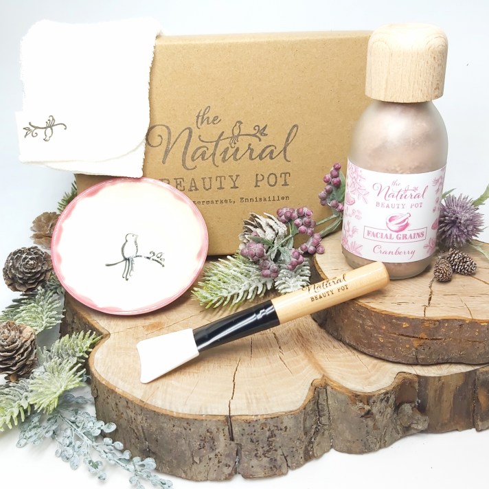 The Natural Beauty Pot's Face Mask Set sat on a wooden log slice with foliage. Natural Beauty Christmas Gift Guide by Beauty Folio
