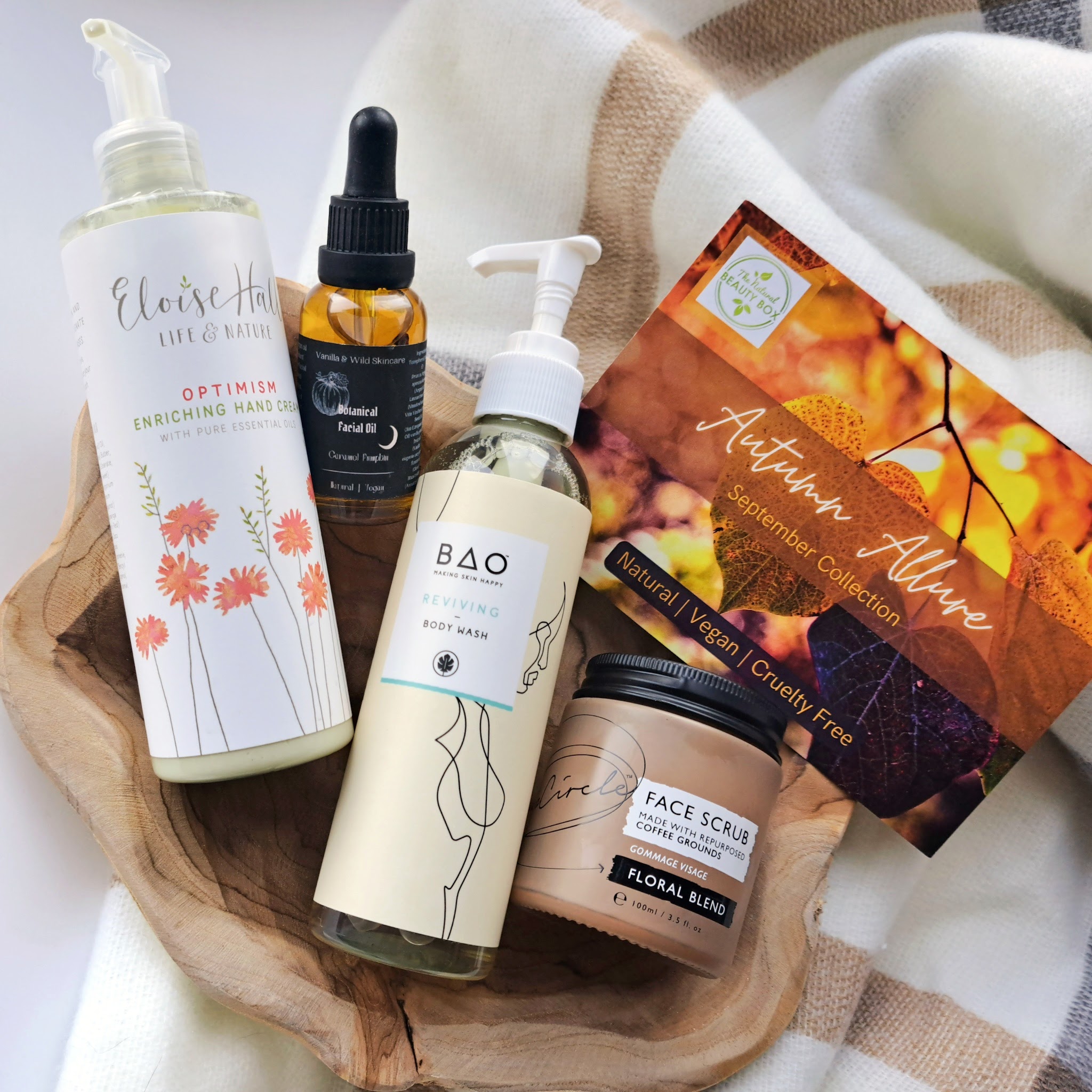 An Autumnal photo of all the products from September's The Natural Beauty Box - Cruelty free, vegan and natural skincare subscription beauty box.