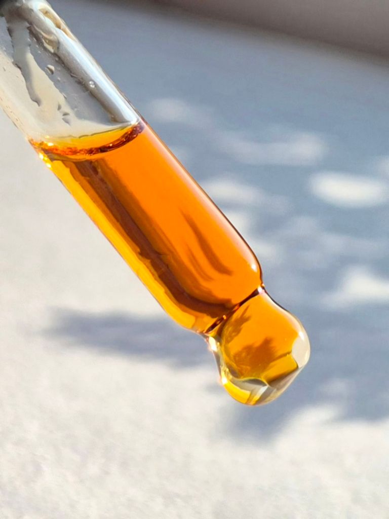 A dropper shot of Leonie Botanics Sunbeam Radiance Booster - Photo by Beauty Folio